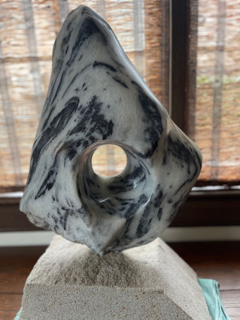 Panda soapstone with a window/portal into space