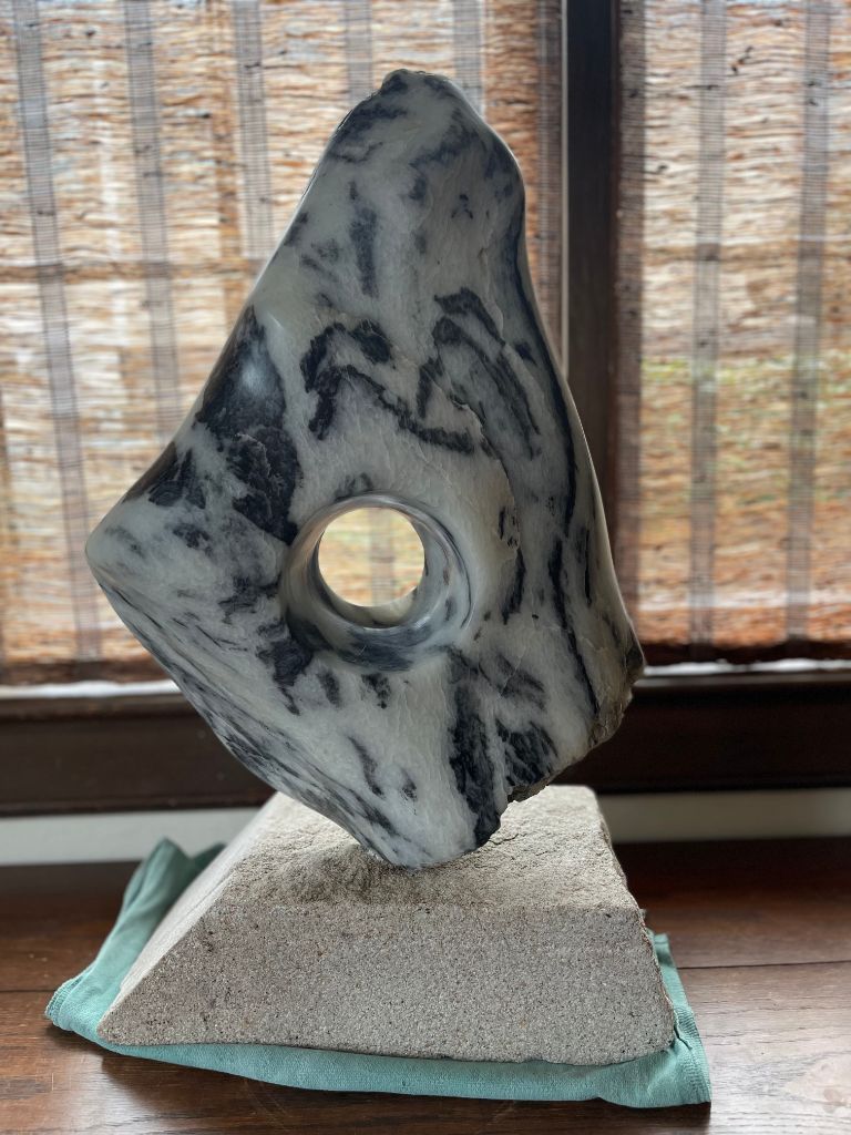 Panda soapstone with a window/portal into space