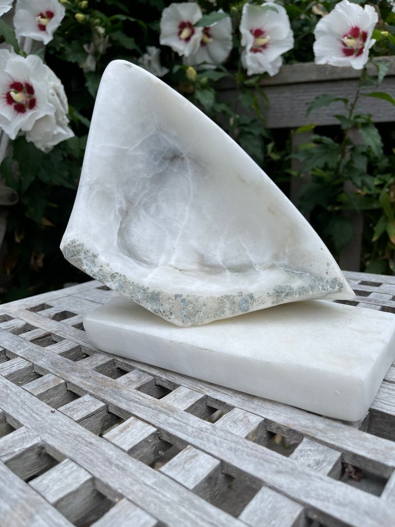 An alabaster sail on a marble sea