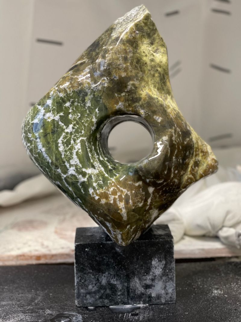 Brazilian soapstone abstract with a portal for viewing the stones center