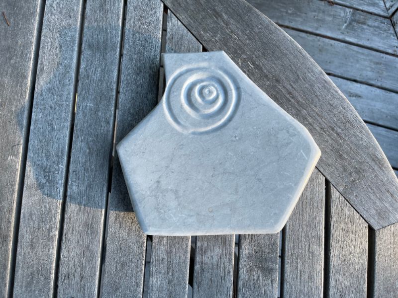 A marble serving plate with eccentric circles